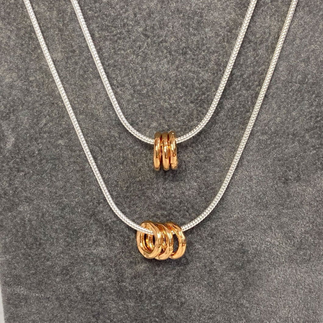 Unisex necklace with gold or silver hammered rings