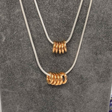 Load image into Gallery viewer, Unisex necklace with gold or silver hammered rings

