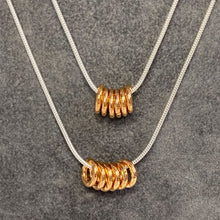 Load image into Gallery viewer, Unisex necklace with gold or silver hammered rings
