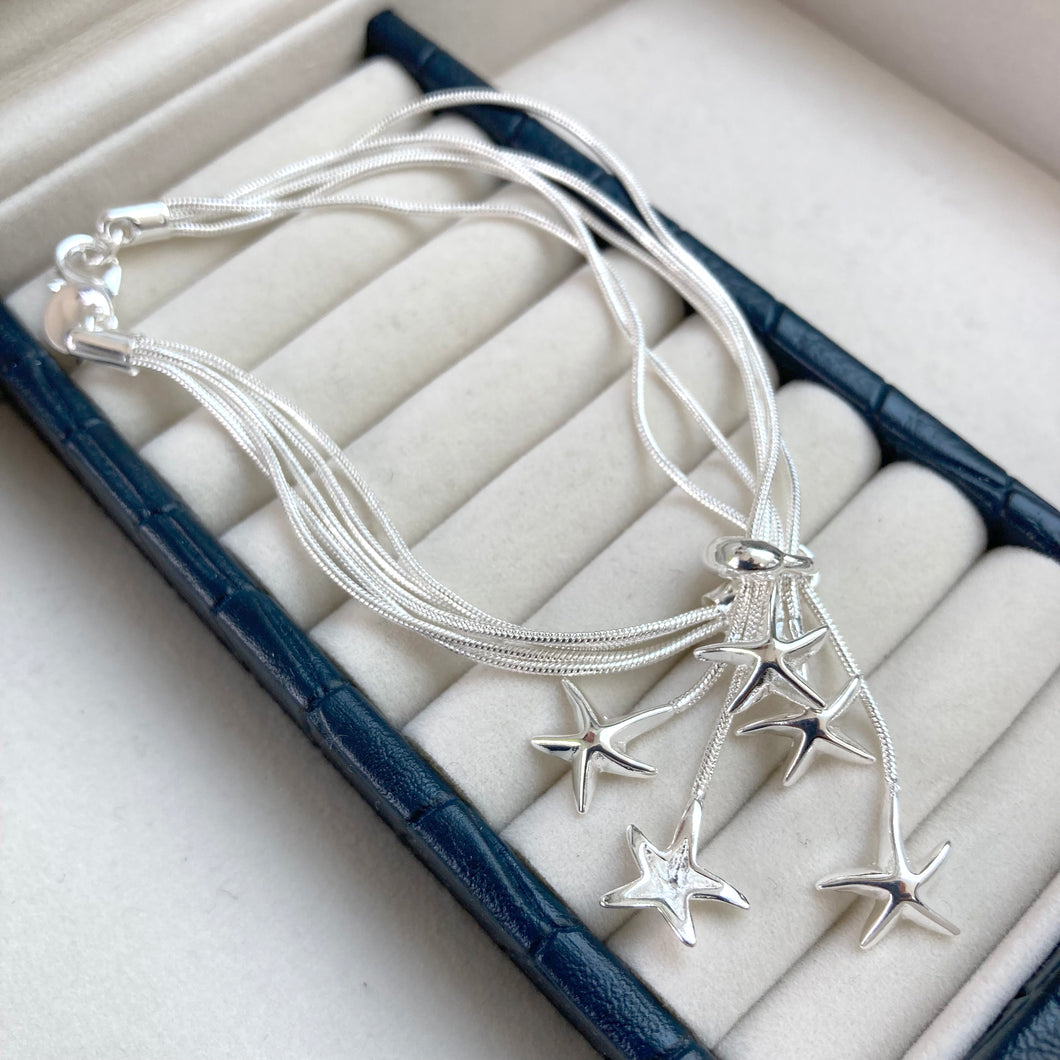 Silver plated multi starfish bracelet